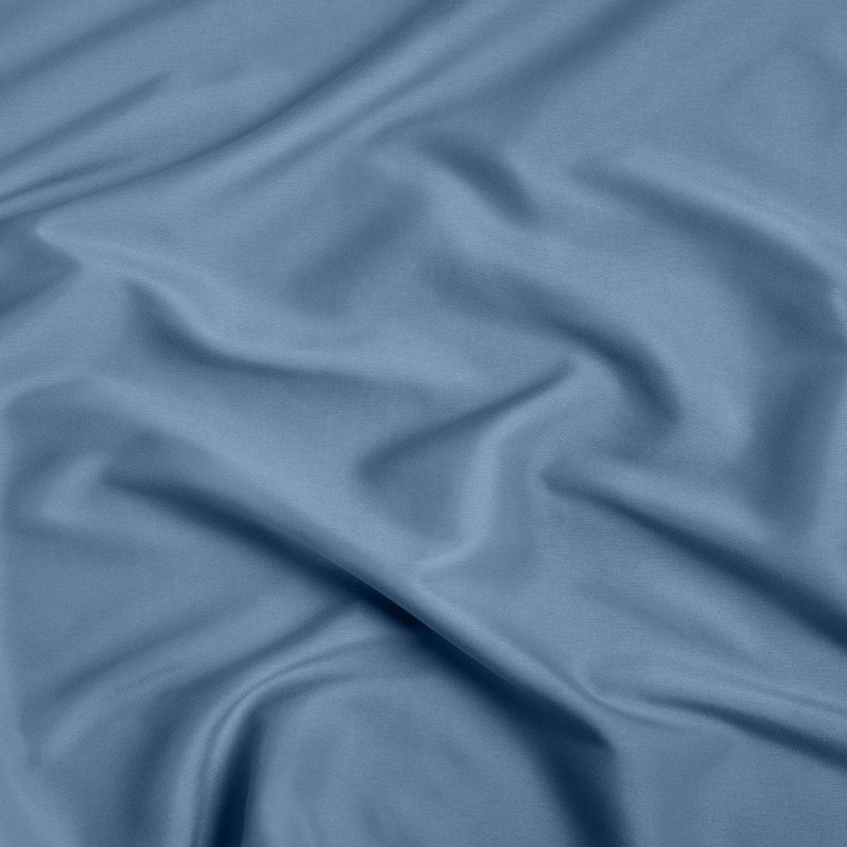 A close-up of ultra soft sheet fabric with soft folds and a smooth texture