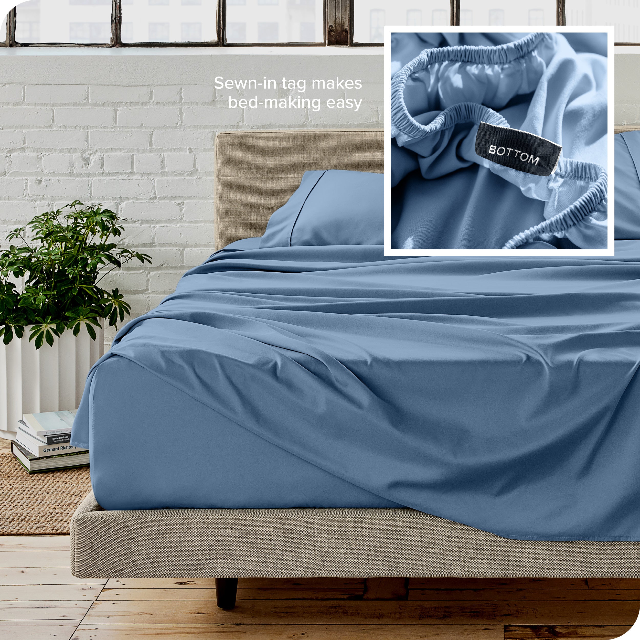 Close up of sewn in tag and matching sheets on a bed