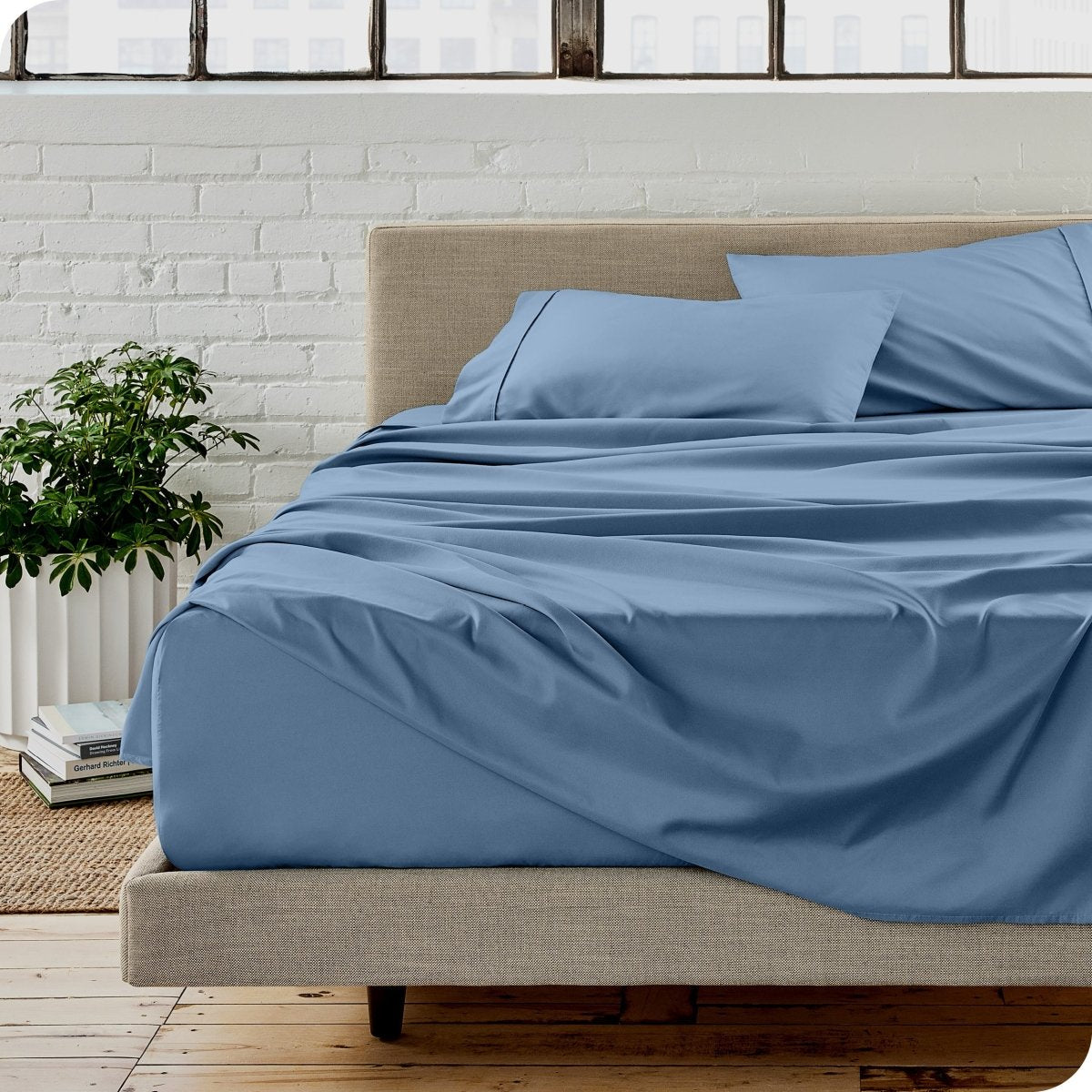 A modern bedroom with microfiber sheets on the mattress