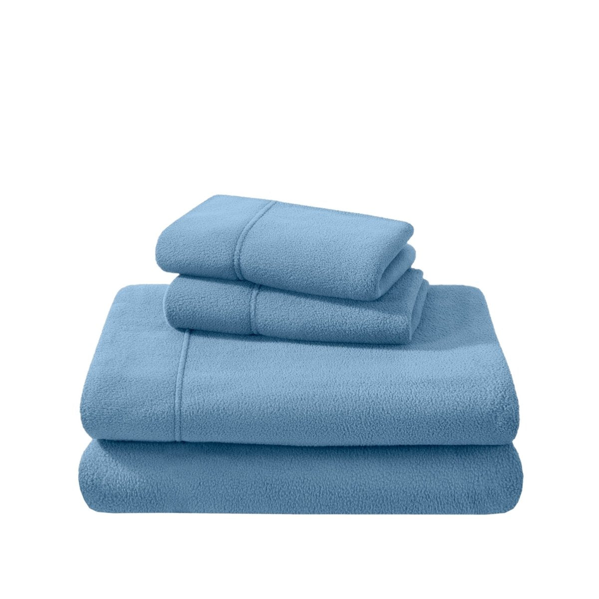 Polar fleece sheets and pillowcases folded and stacked on a white background