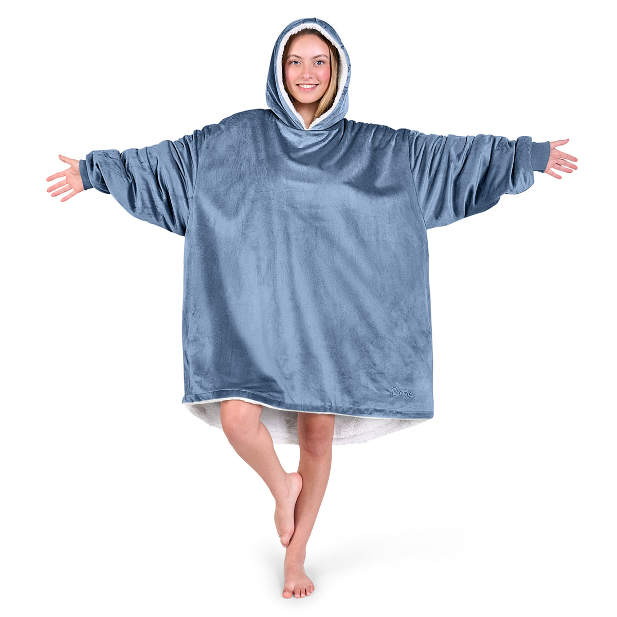 An adult with a sherpa wearable blanket on