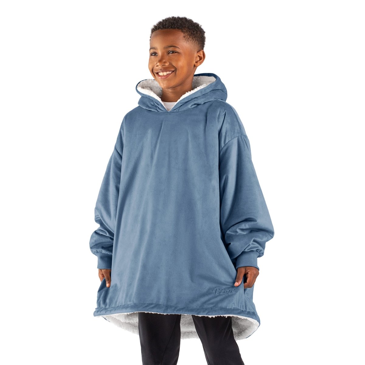 A child with a sherpa wearable blanket on