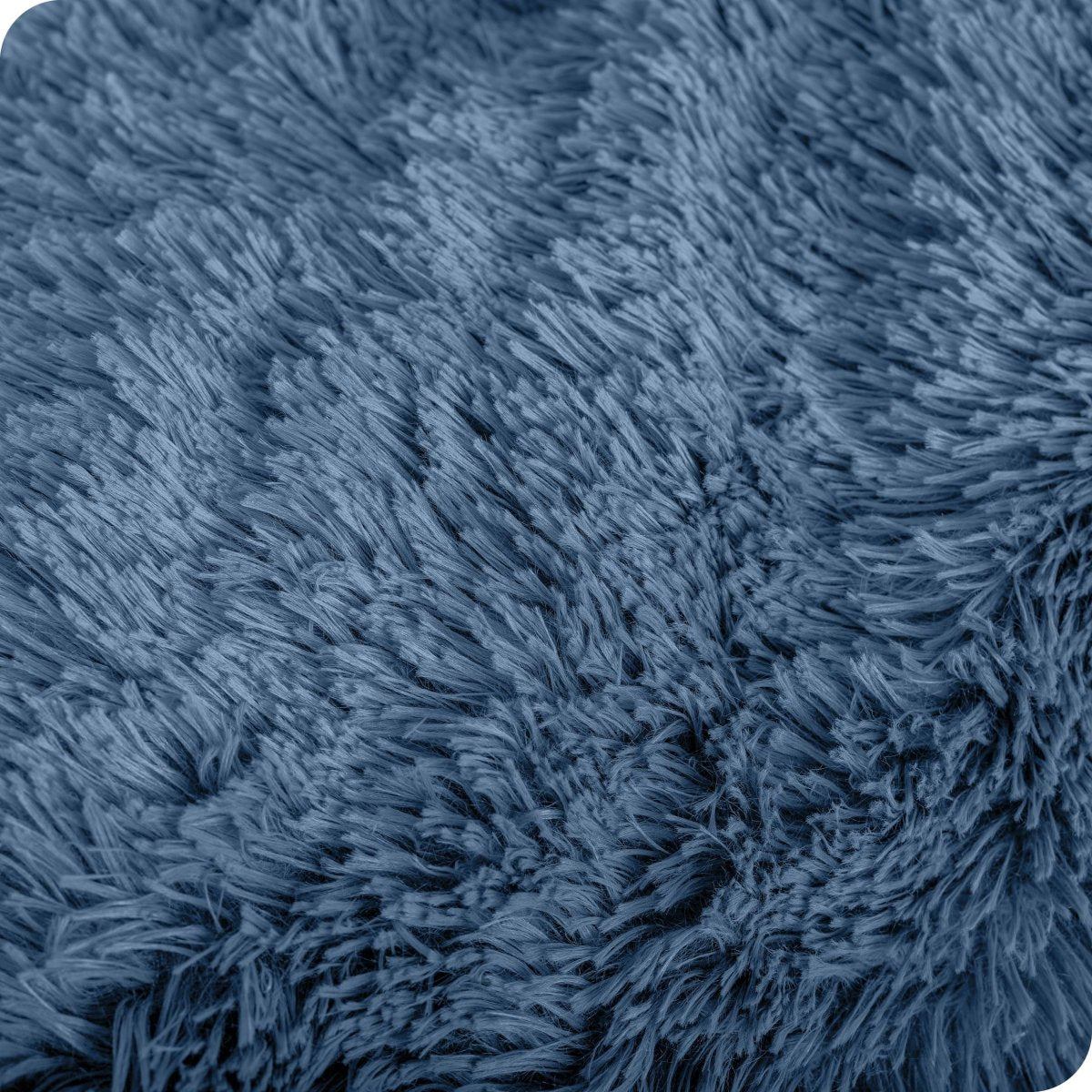 Close up of the soft texture of a shaggy faux fur sherpa blanket