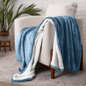 Blanket draped over a chair in a cozy living room setting.