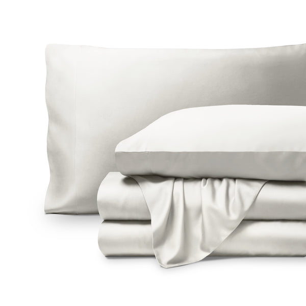 Bamboo pillowcases and sheets set on a white background