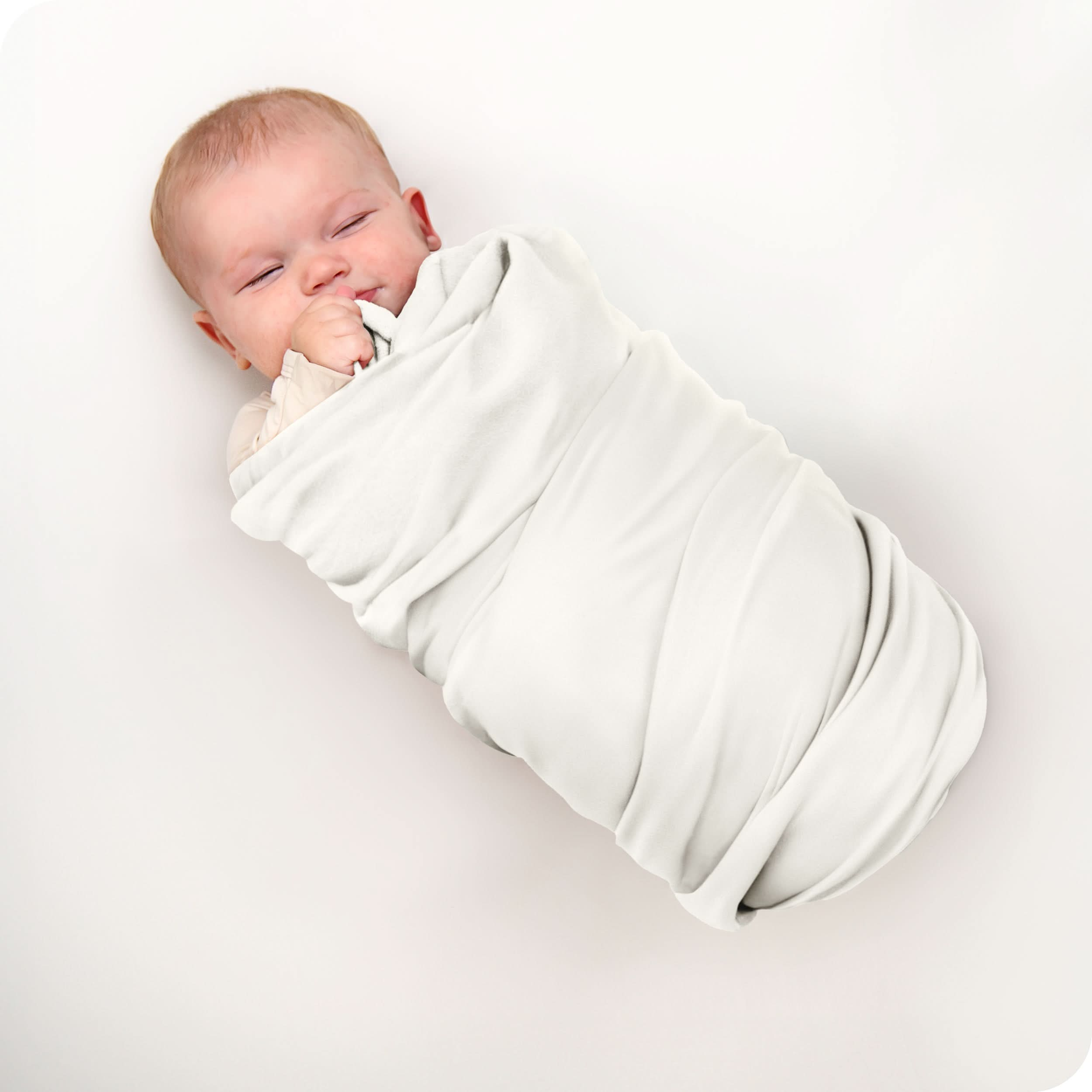 A baby swaddled in a receiving blanket