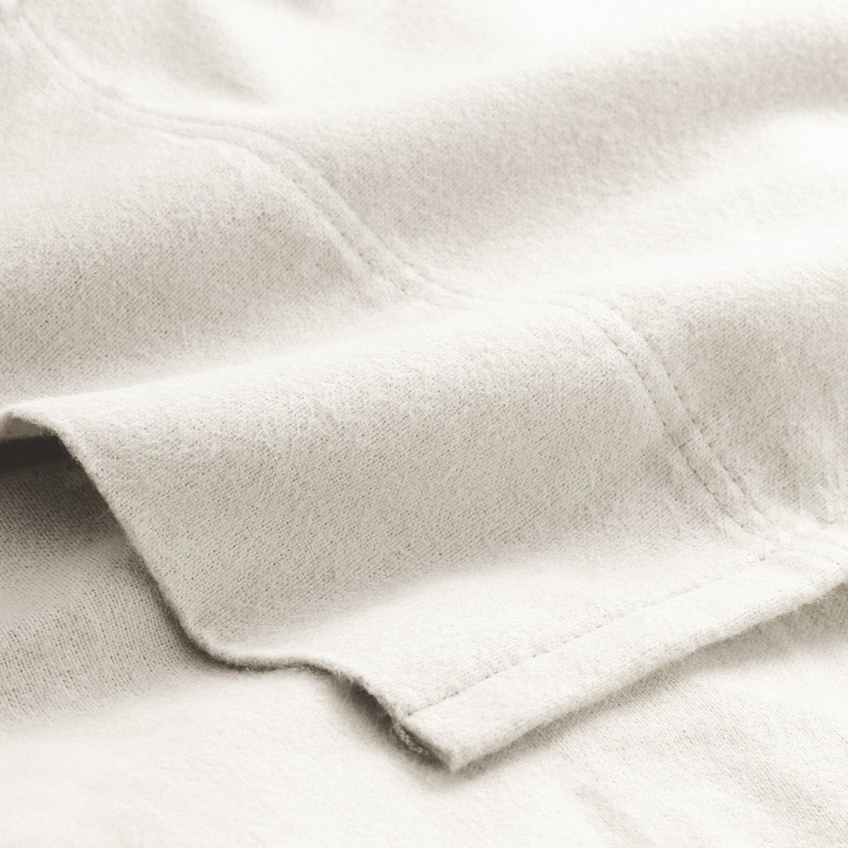 Close-up of flannel fabric with a focus on texture and color.