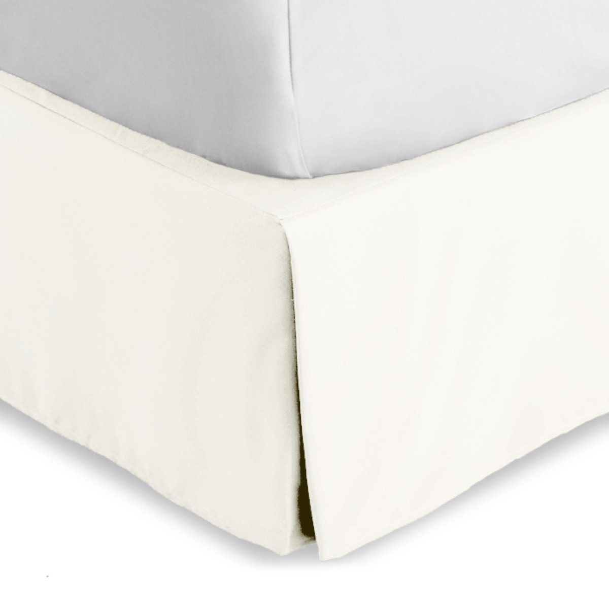 Bed skirt on a bed with white bedding