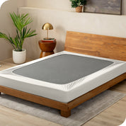 Cream box spring cover on a box spring