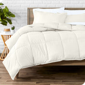 A modern bed with a down alternative comforter set on it