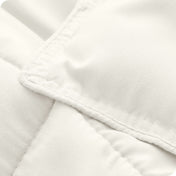 A close up of a corner of the microfiber comforter