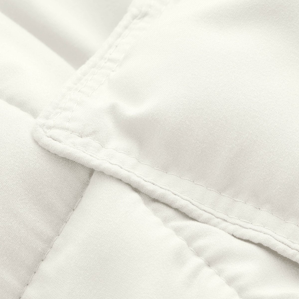 Close-up of comforter fabric with stitching detail