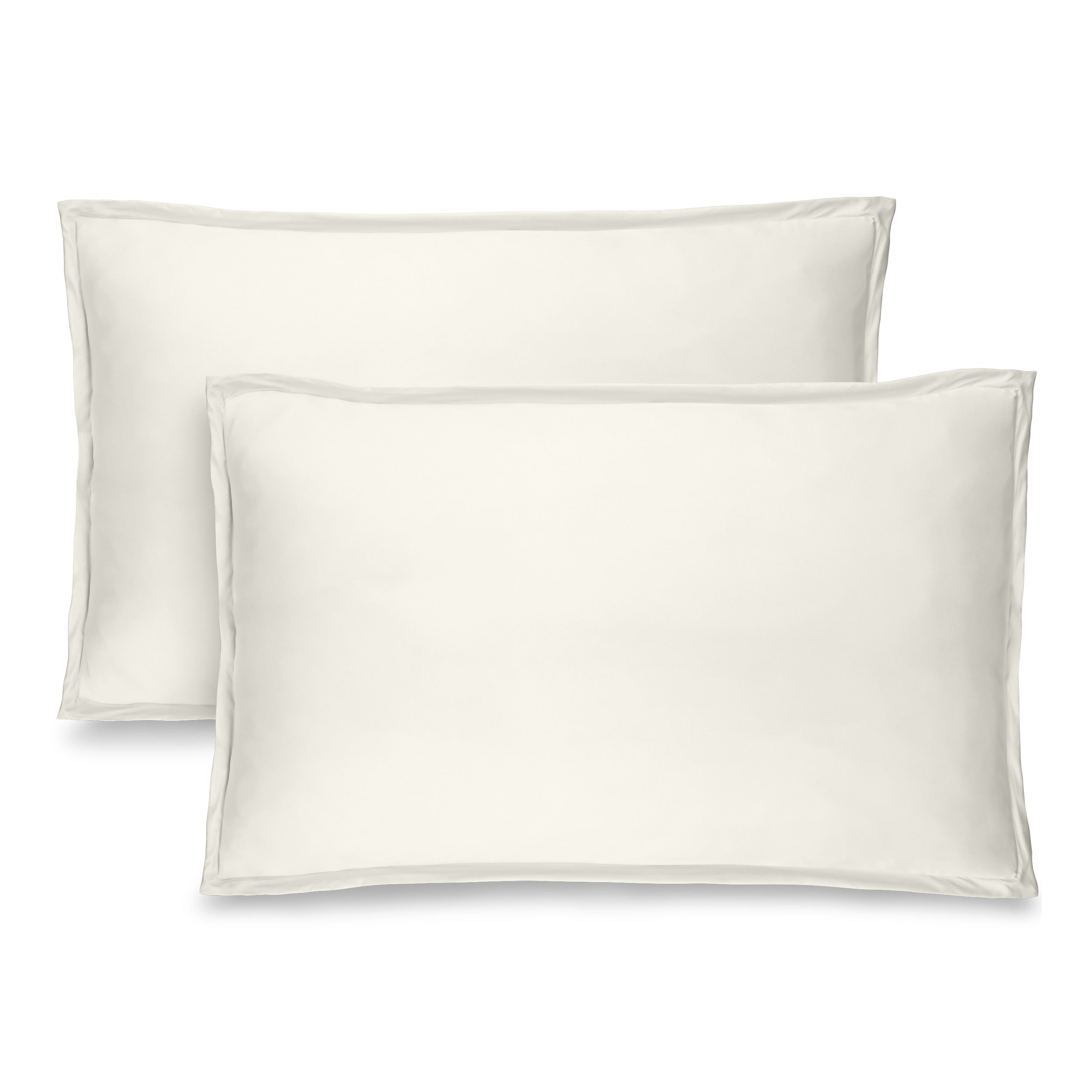 Two cream pillow shams on pillows standing up with one behind the other