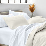 Close up of pillow shams on a bed