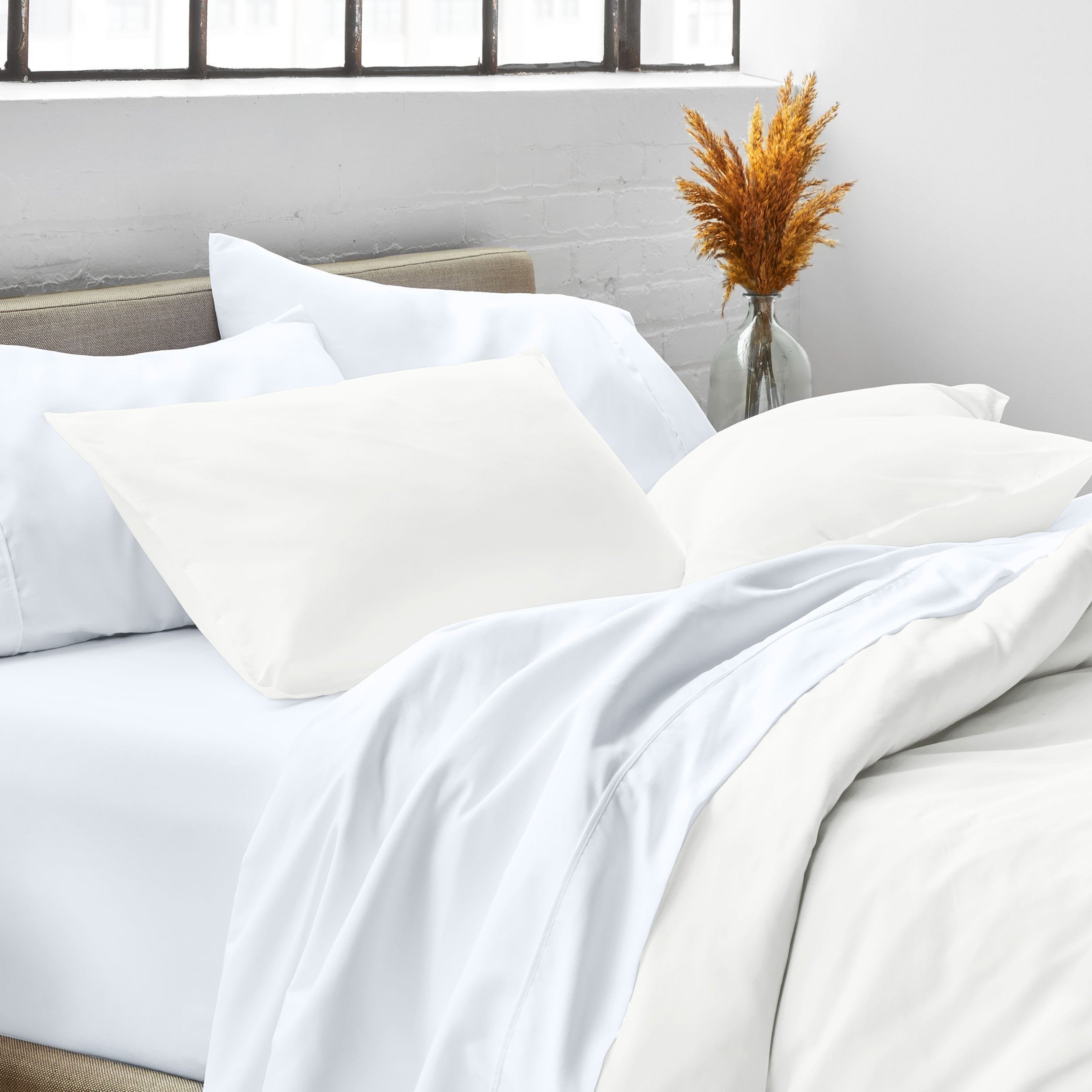 Close up of pillow shams on a bed