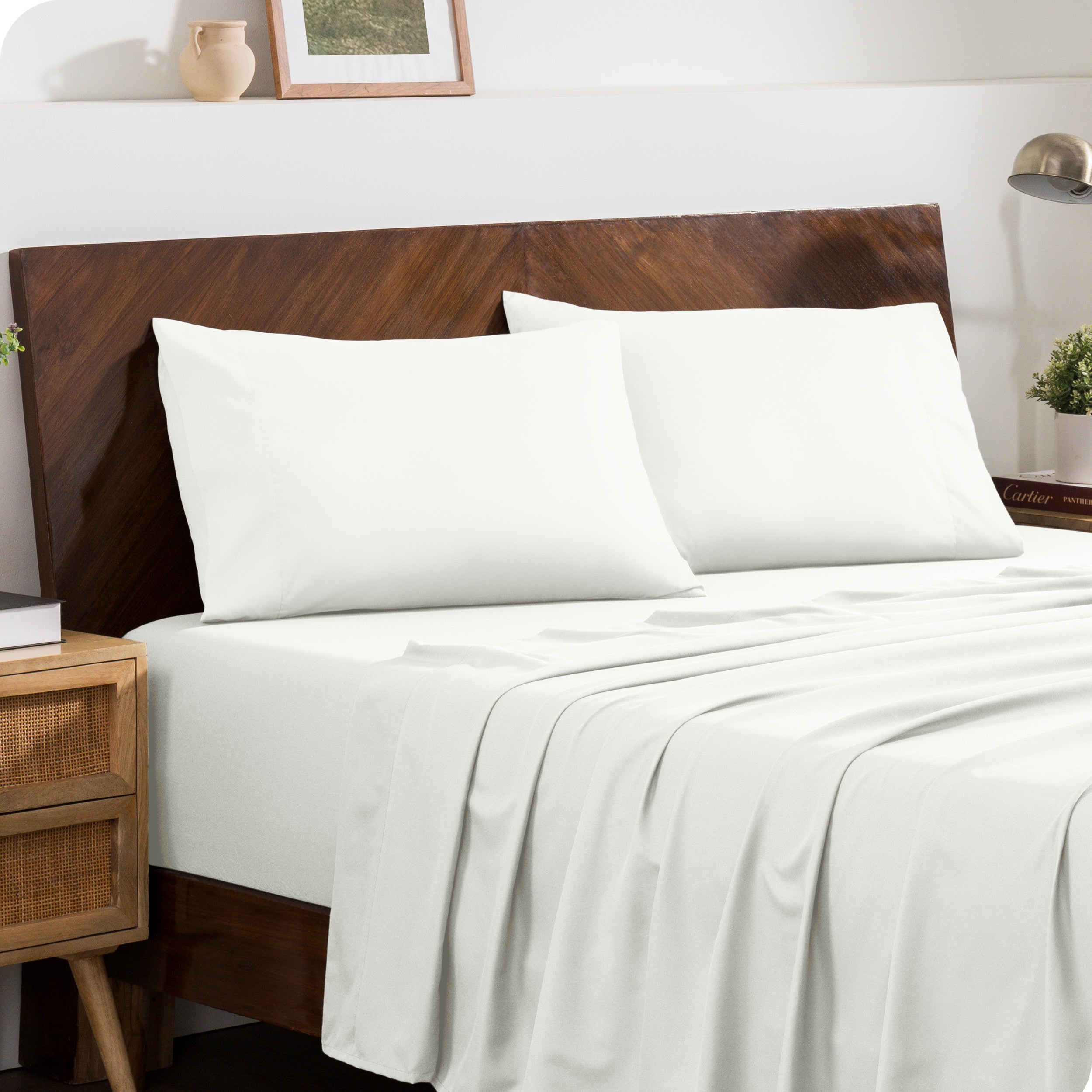 2 pillowcases on pillows on a nicely made bed