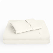 Microfiber sheet set folded and stacked neatly.