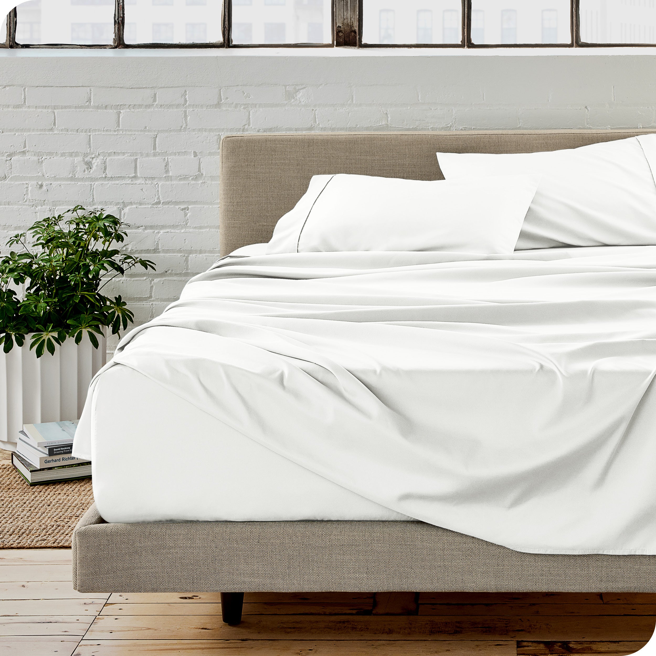 A modern bedroom with microfiber sheets on the mattress