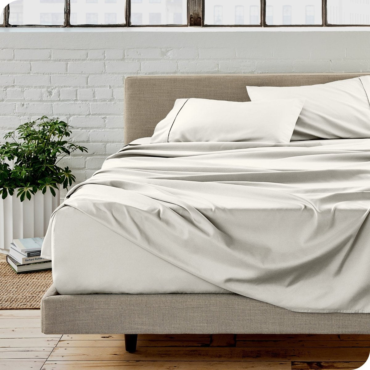 A modern bedroom with microfiber sheets on the mattress