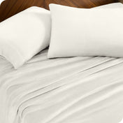 A sheet set and matching pillowcases on a bed.