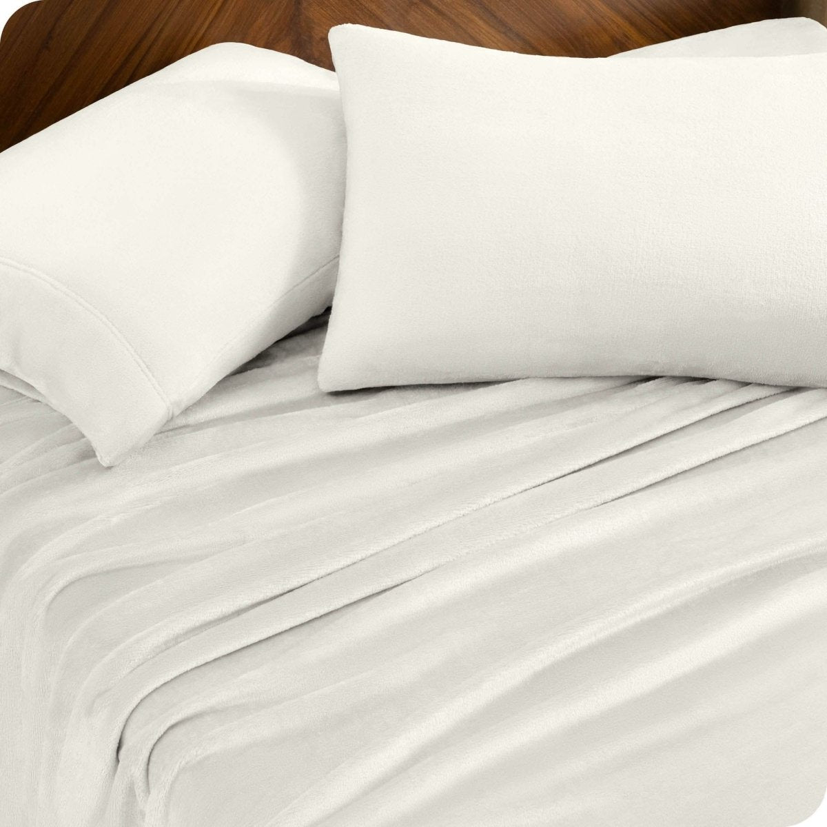 A sheet set and matching pillowcases on a bed.