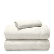 Stack of microplush sheets on a white background