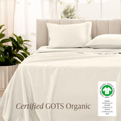 Bed with sateen bedding and pillowcases, featuring a GOTS Organic certification label.
