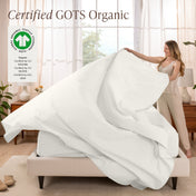 A woman is making a bed with organic cotton percale sheets
