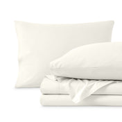 Percale sheets folded and matching pillowcases with pillows in them