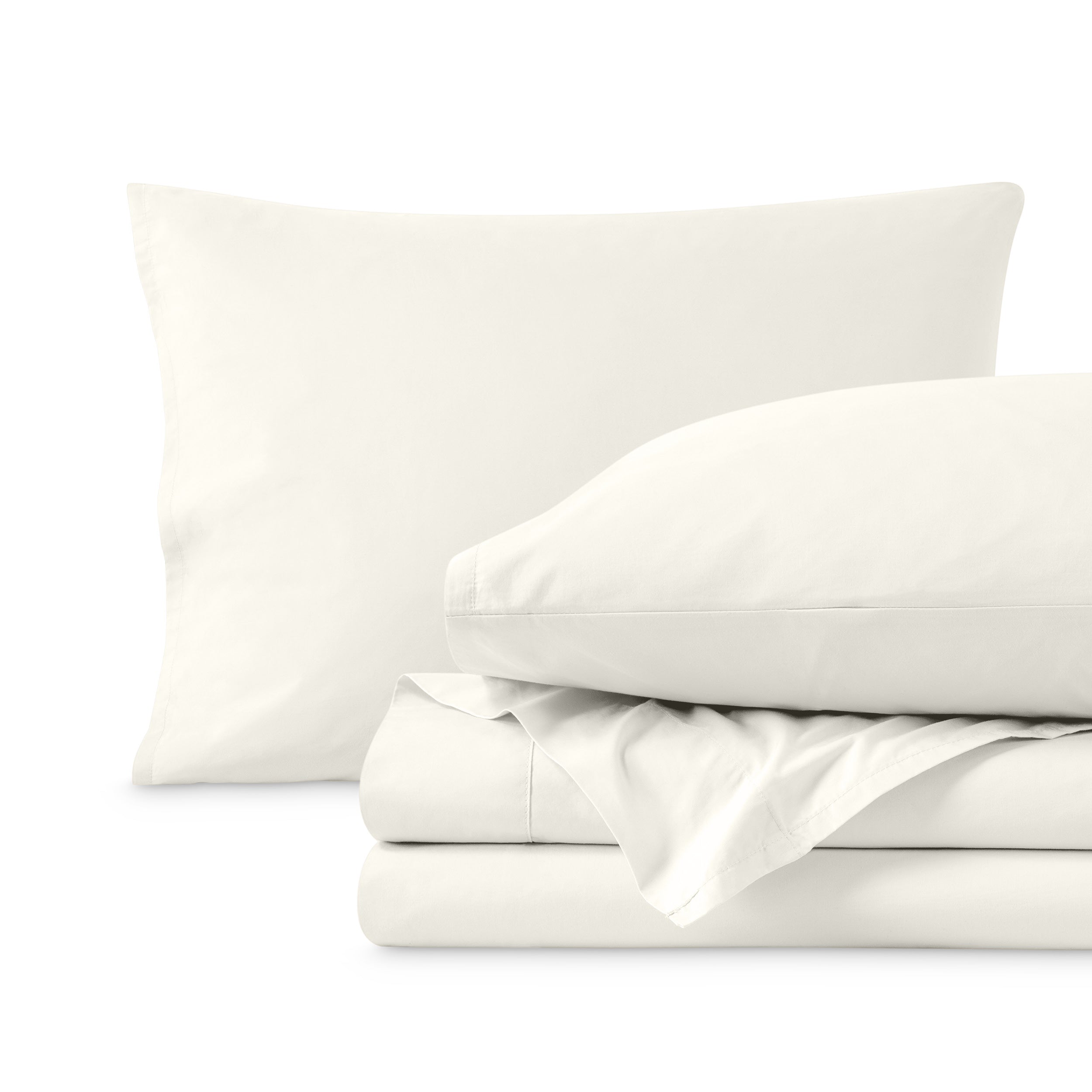 Percale sheets folded and matching pillowcases with pillows in them