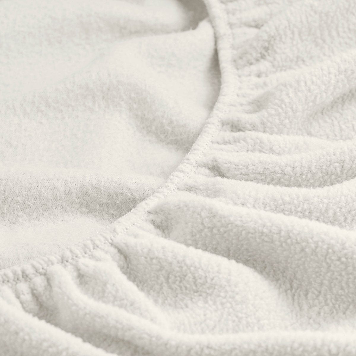 Close-up of a fitted sheet with all around elastic