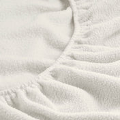 Close-up of a fitted sheet with all around elastic