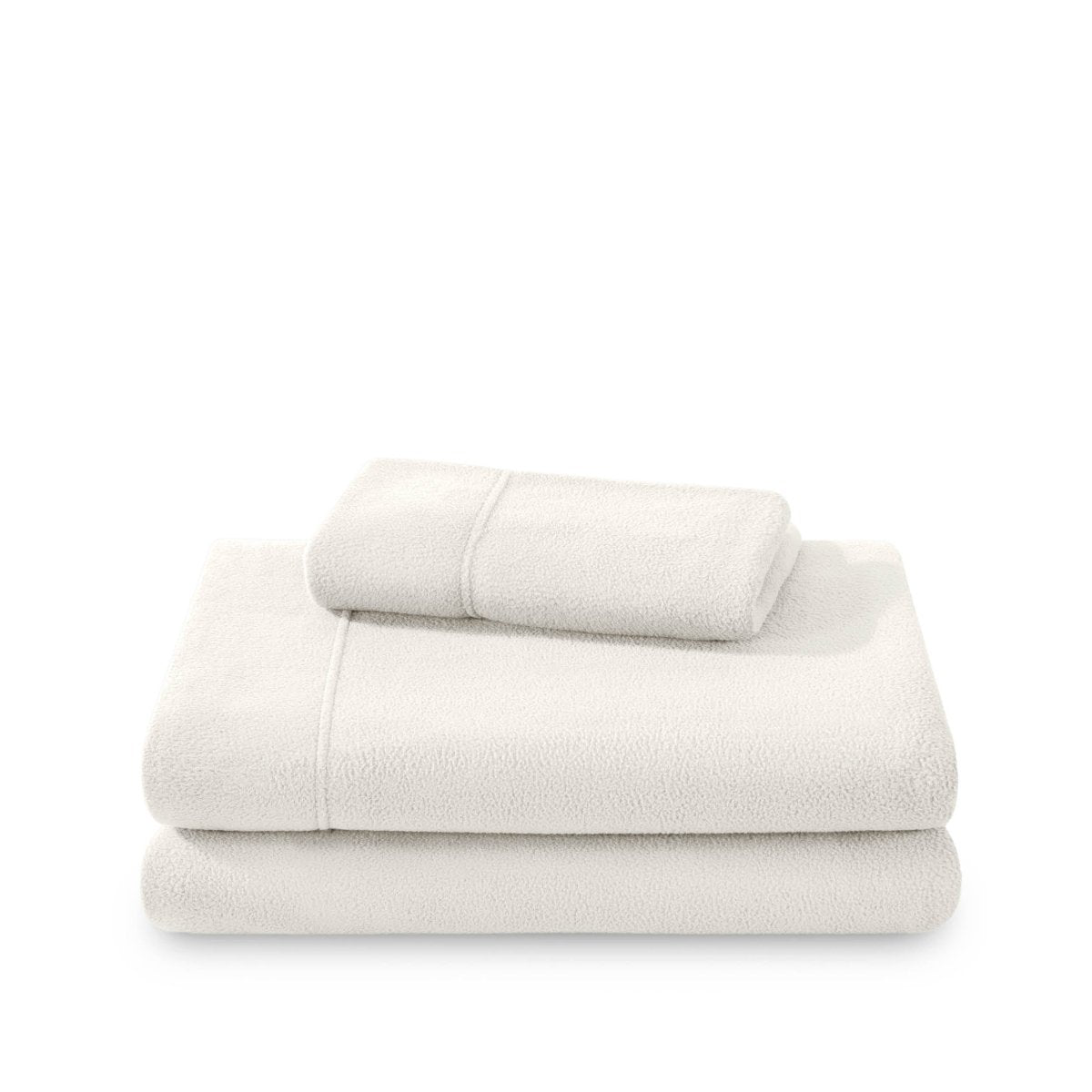 Polar fleece sheets and pillowcases folded and stacked on a white background