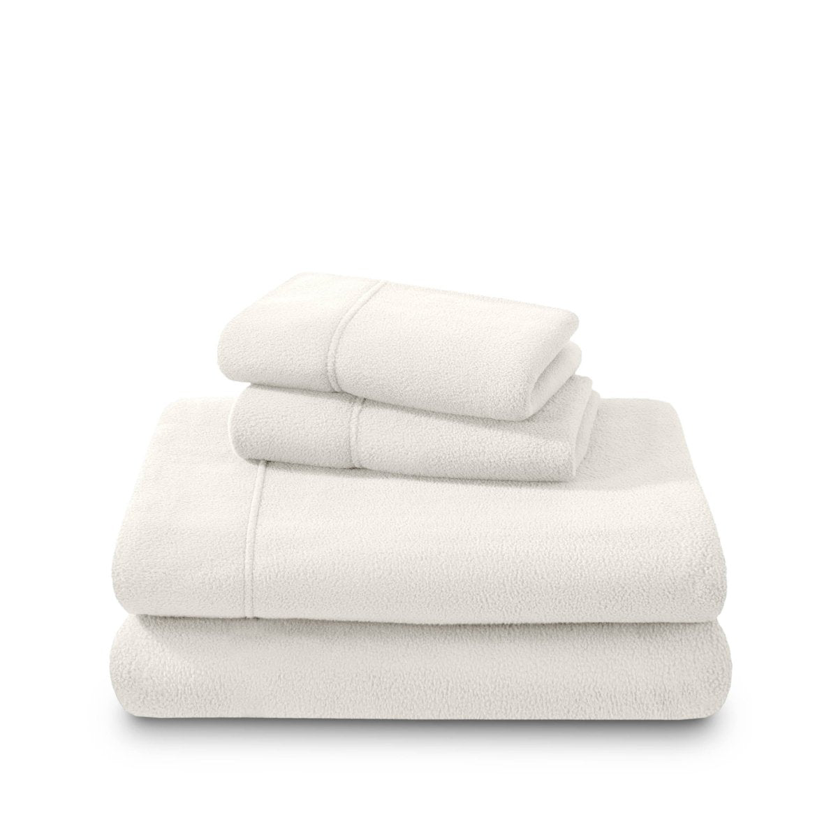 Polar fleece sheets and pillowcases folded and stacked on a white background