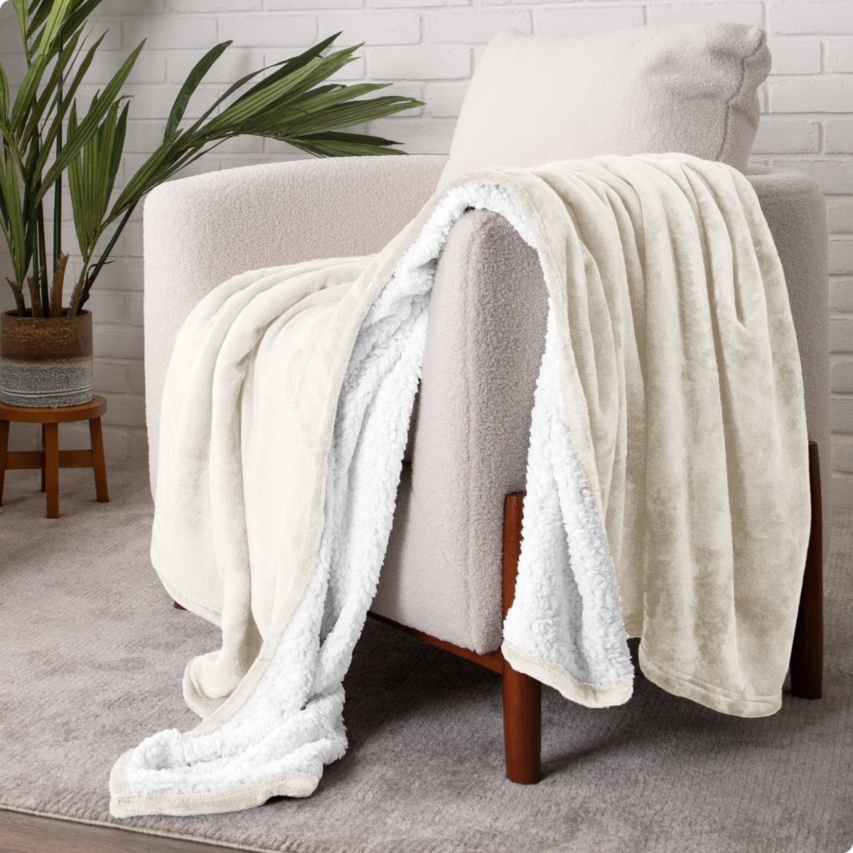Blanket draped over a chair in a cozy living room setting.