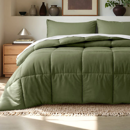 Comforter on a bed in a bedroom setting with a wooden nightstand and decorative items.
