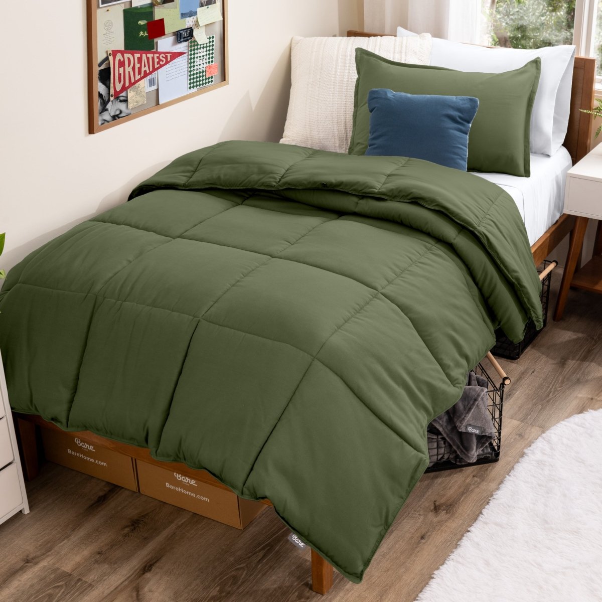 Bed with comforter and pillows in a dorm room
