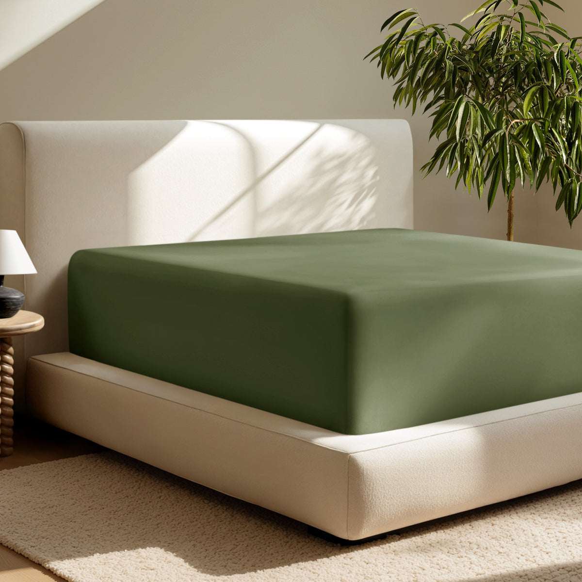 A deep pocket fitted sheet on a mattress