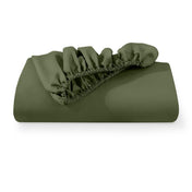 A fitted sheet folded neatly with the all around elastic showing