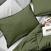 Microfiber pillow sham set on a bed with a magazine on top of the comforter.