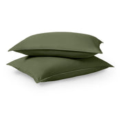 Two pillows stacked on a white background