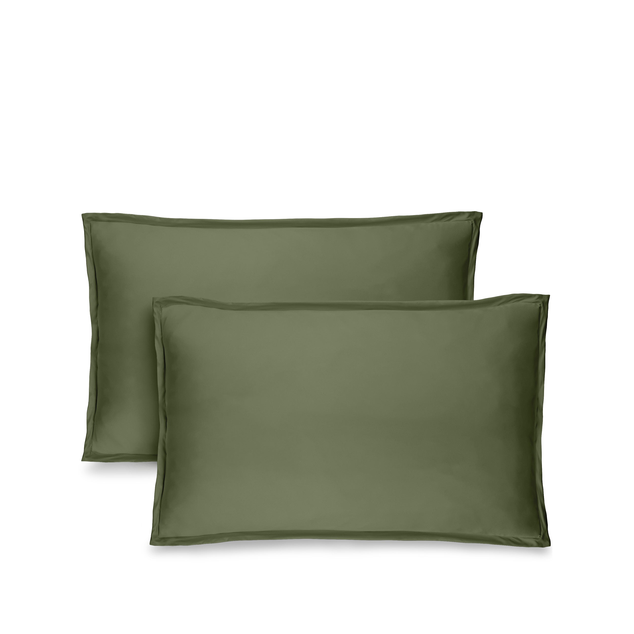 Two green pillow shams on pillows standing up with one behind the other