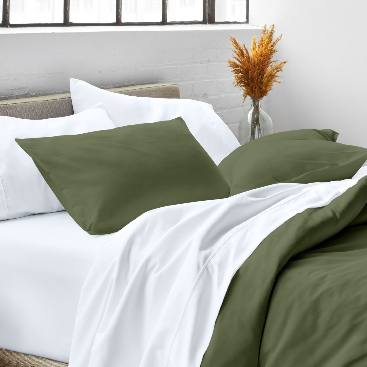 Close up of pillow shams on a bed