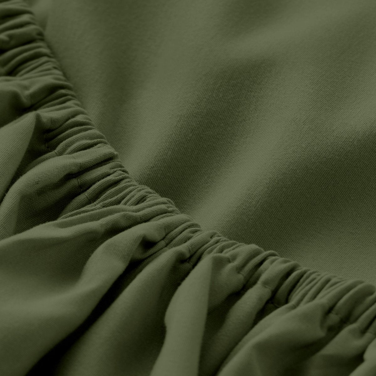 A close-up of a fitted sheet with elasticized edge.