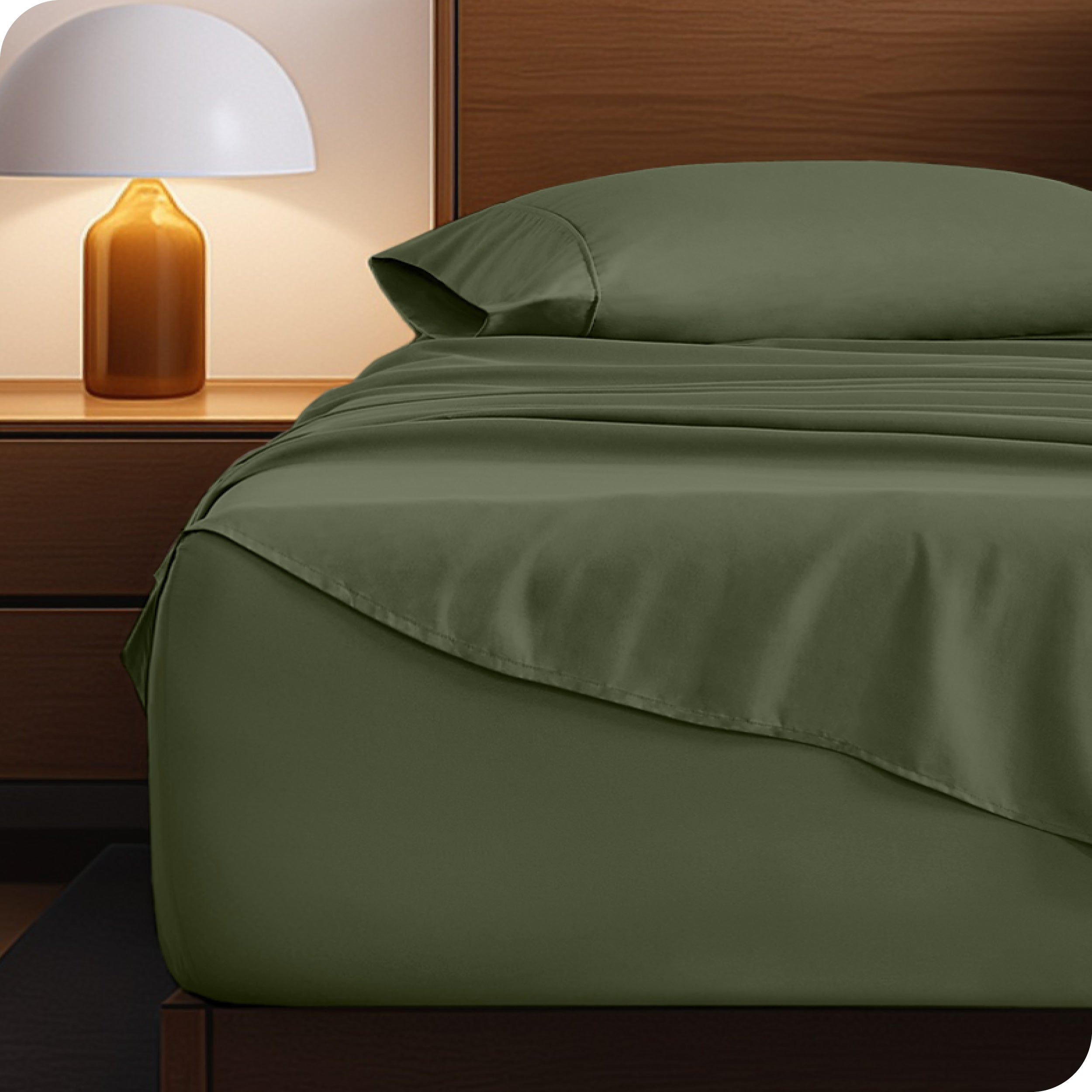 Microfiber bed sheets on a neatly made bed with a wooden headboard and nightstand.