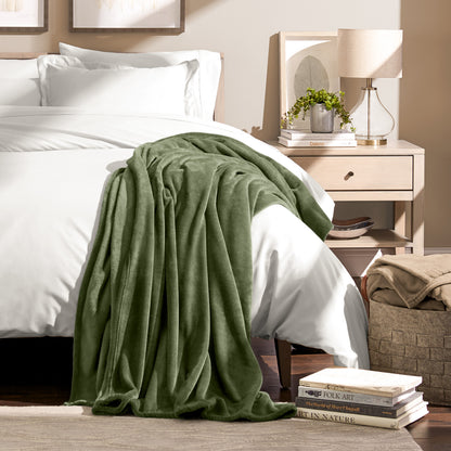 Microplush blanket draped over the corner of a bed