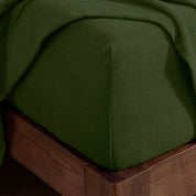 Corner of a mattress with a fitted sheet on it