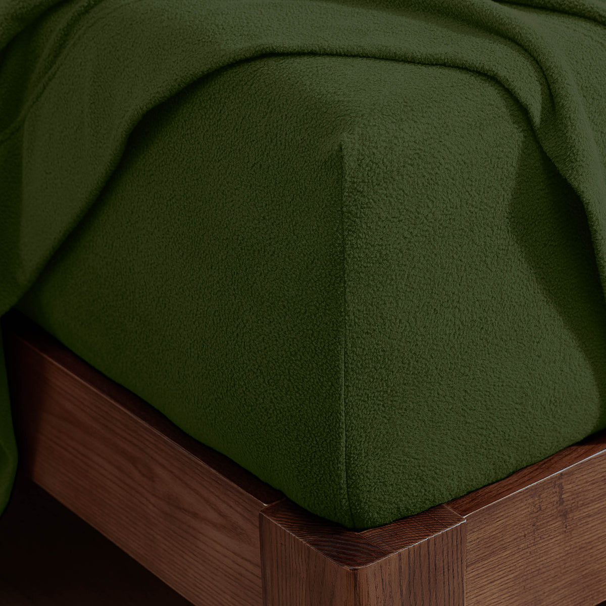 Corner of a mattress with a fitted sheet on it