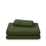 Polar fleece sheets and pillowcases folded and stacked on a white background