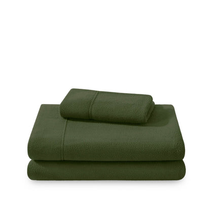 Polar fleece sheets and pillowcases folded and stacked on a white background